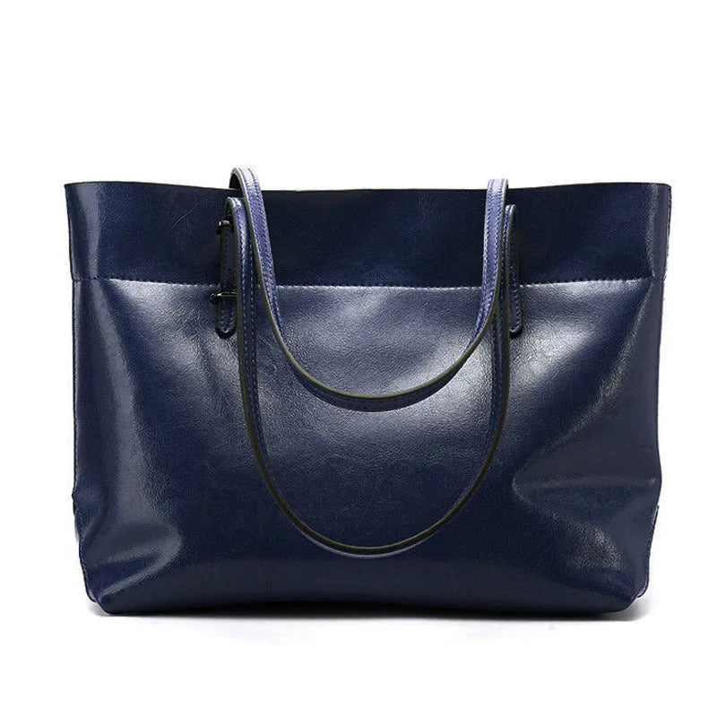 Women's wax cowhide leather handbag with horizontal silhouette and cross-body strap