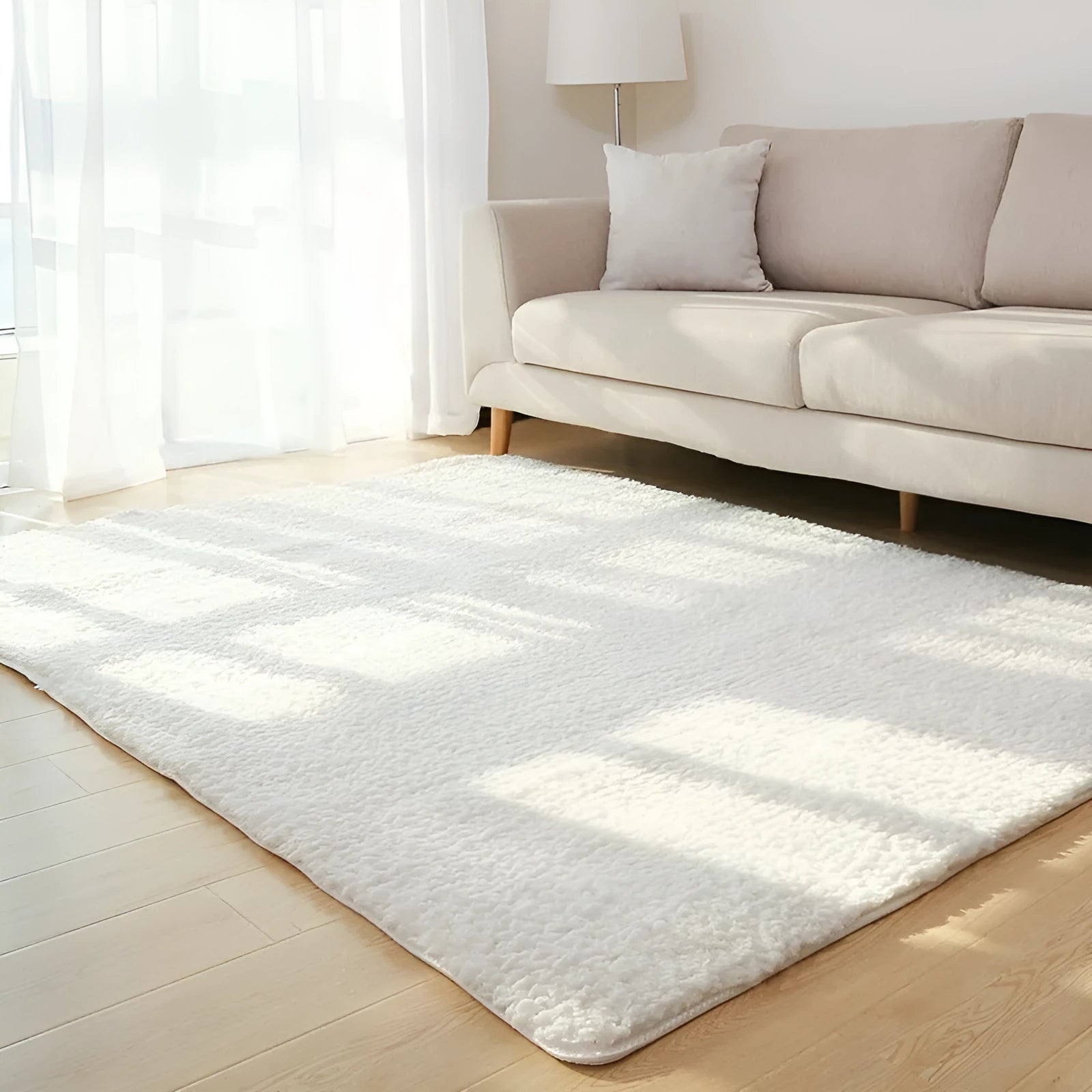 Solid colour plush area rug with non-slip dot-patterned bottom in rectangular shape