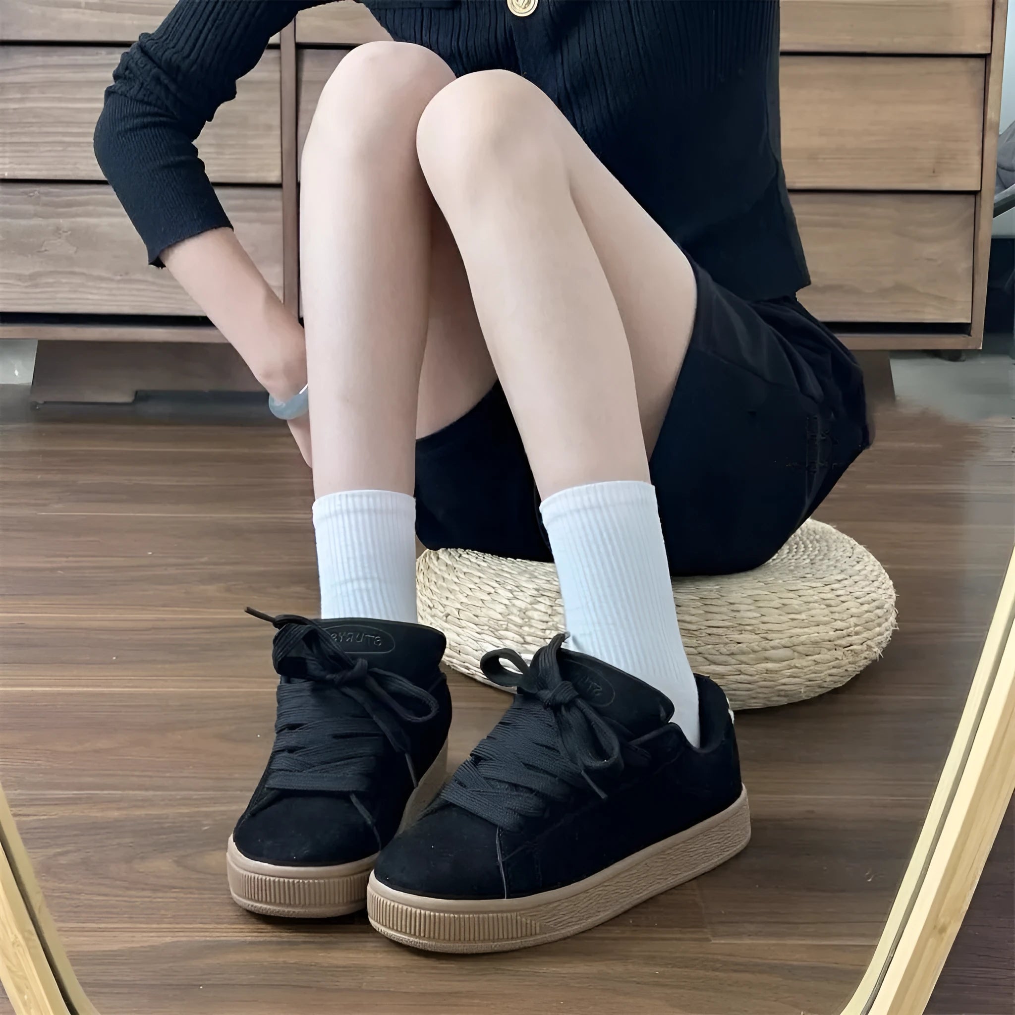 Retro black low-top sneakers with round toe and lace-up front for men and women