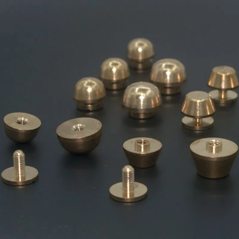 Brass decorative buckle with geometric and round foot nail designs in 10x6mm and 12x7mm sizes.