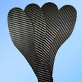 Black 3K carbon fiber running insoles showing full palm design, placed next to a running shoe.