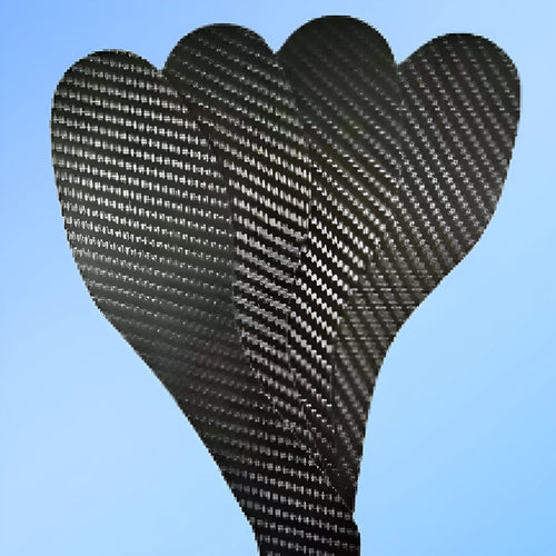 Black 3K carbon fiber running insoles showing full palm design, placed next to a running shoe.