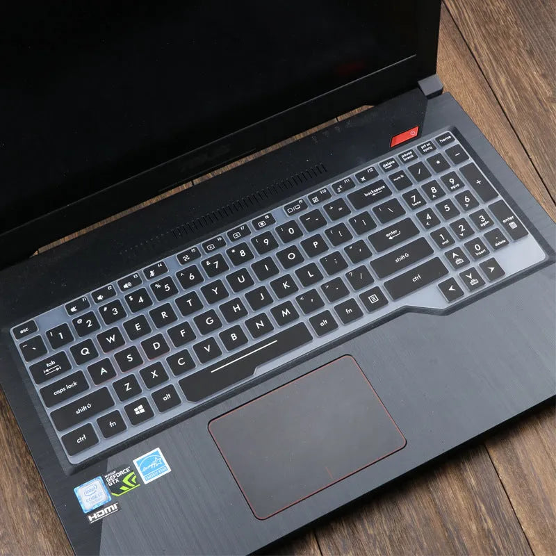 Transparent silicone keyboard protective film for ASUS Flight laptop on a keyboard.