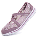 Women's beige lace-up casual flats with mesh upper and round toe on a light background.