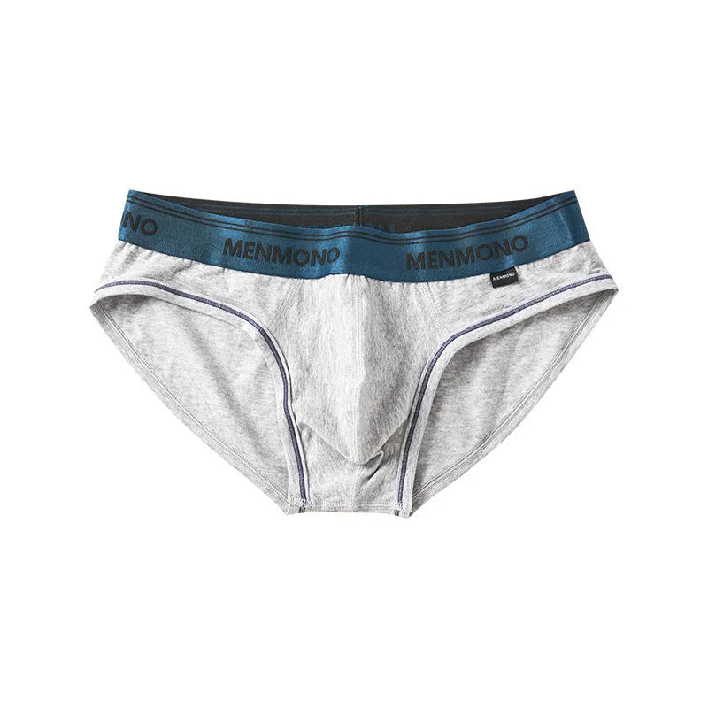 Men's low waist cotton briefs in a selection of solid colours including black and blue, white and red.