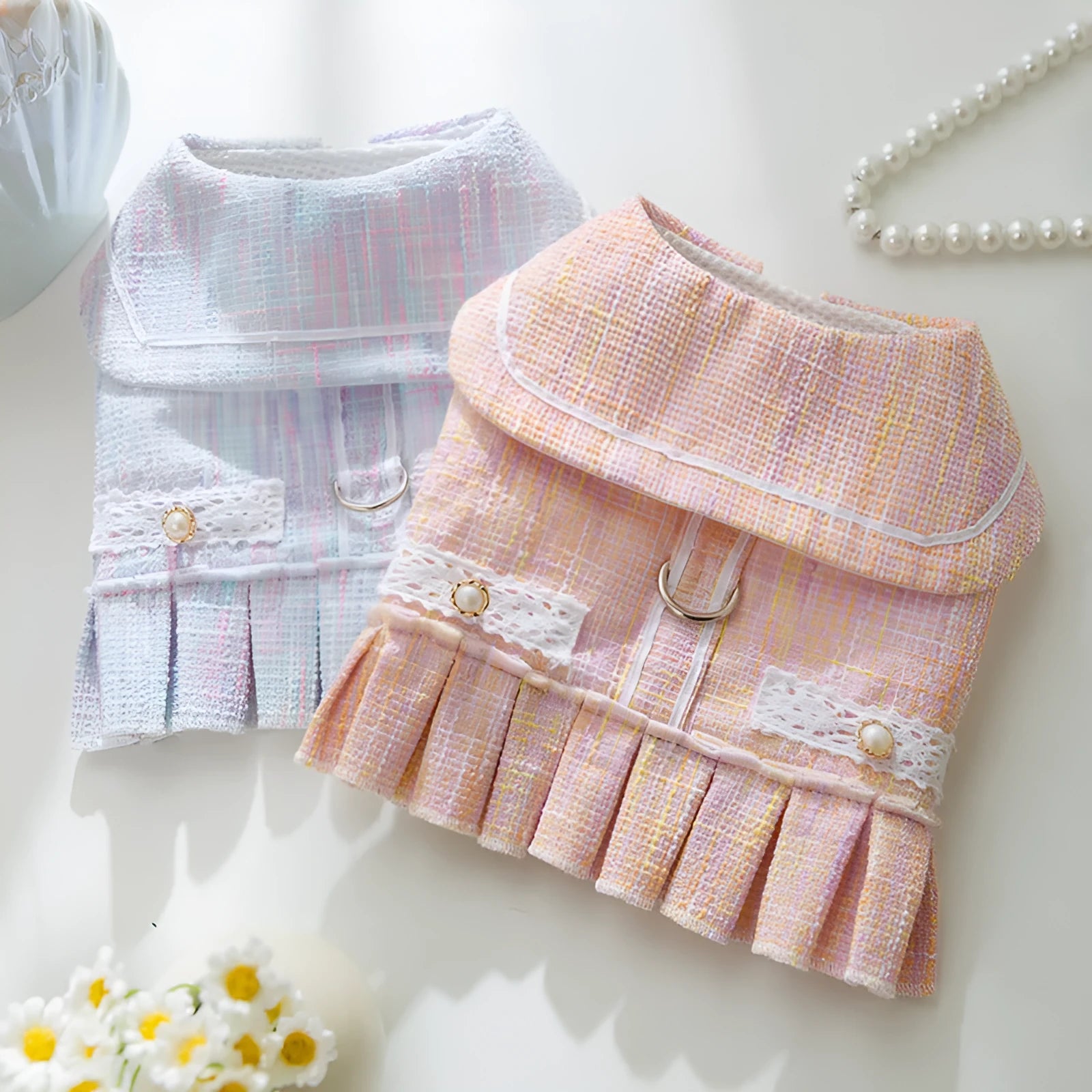 Purple and pink lightweight polyester pet clothes for small dogs and cats in sizes S, M, L, and XL.
