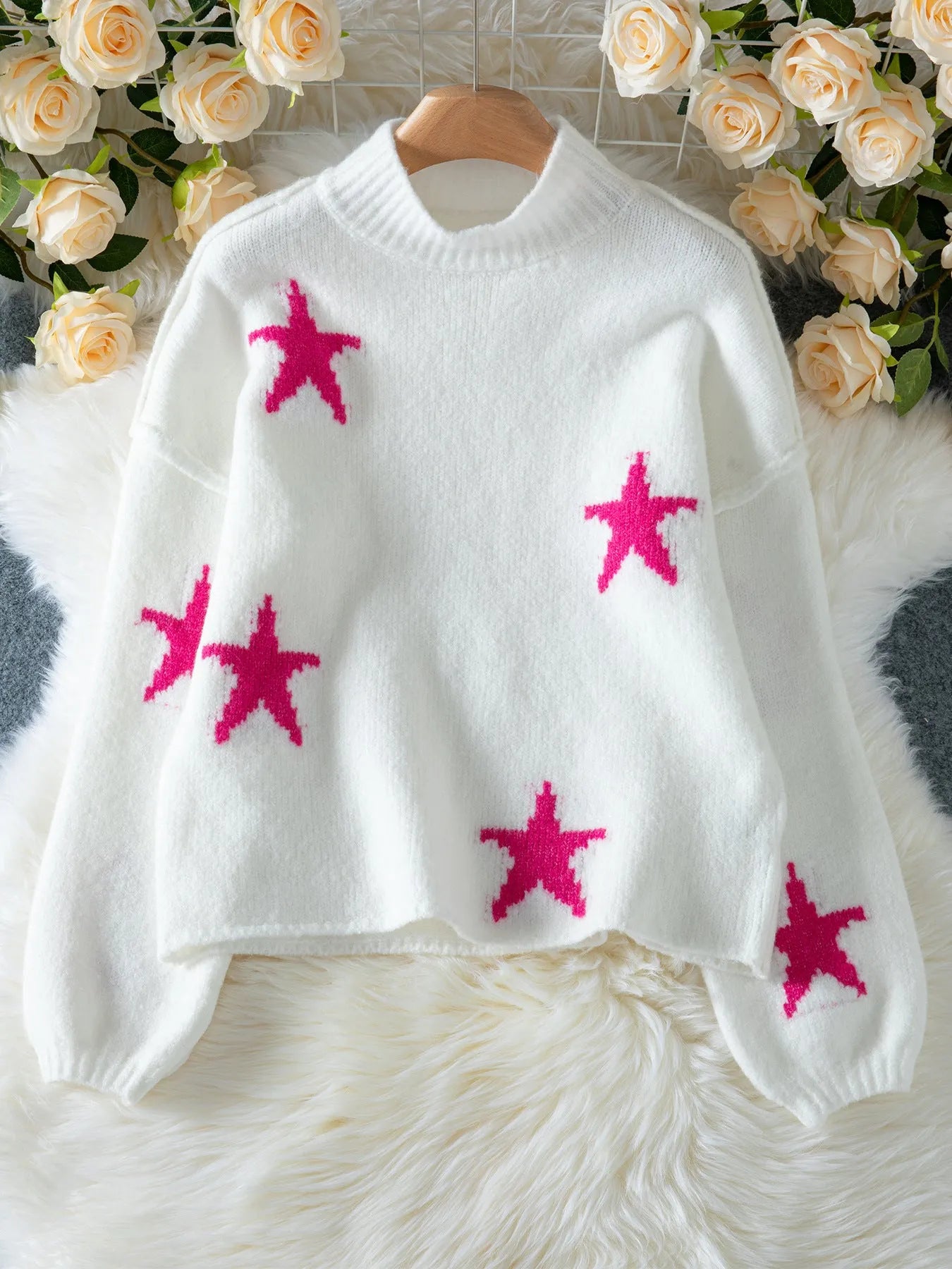 White women's loose fit turtleneck pullover with five-pointed star pattern detail
