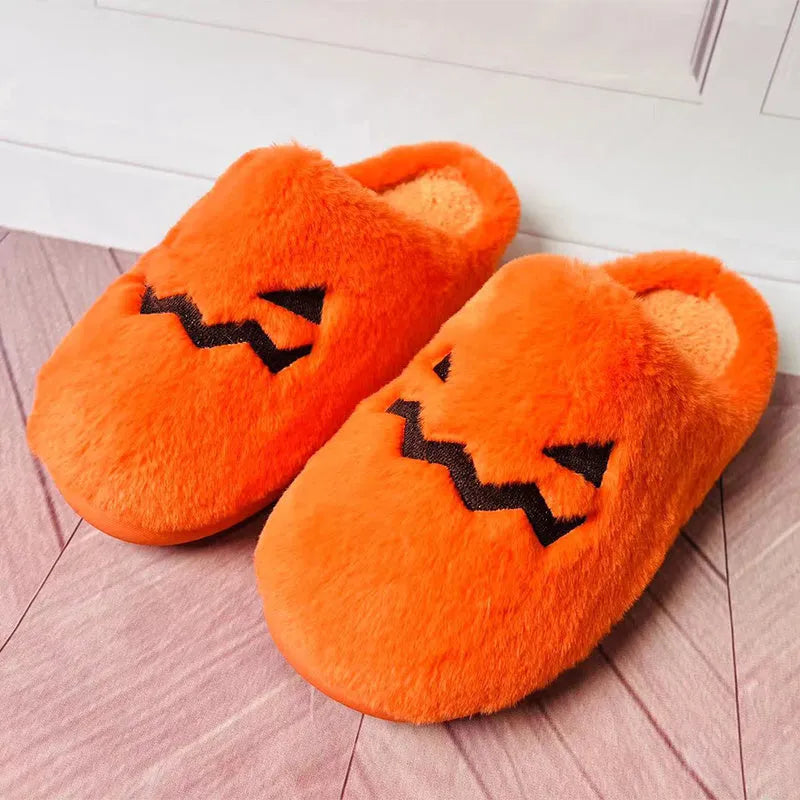 Orange pumpkin design Halloween slippers with plush lining and PVC sole for indoor home wear