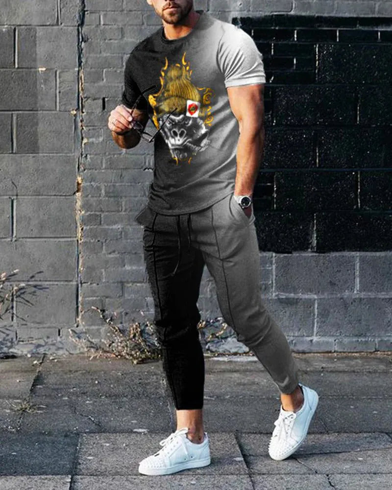 Man wearing a short-sleeved printed round neck pullover and matching trousers from a lightweight athletic suit set.