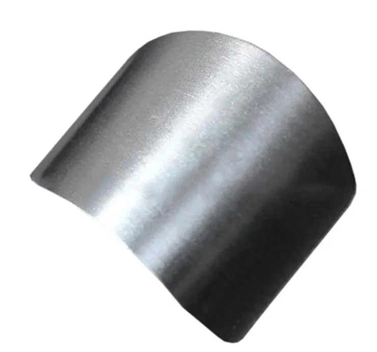 Stainless steel finger guard for protecting fingers when cutting vegetables on a chopping board.