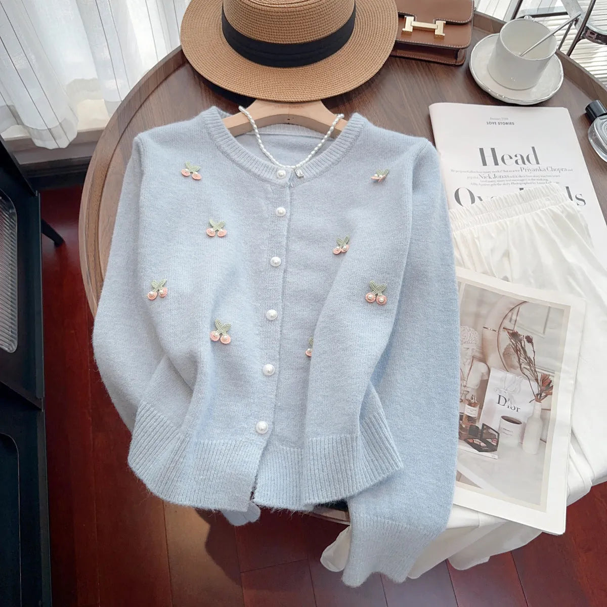 Women's beaded cardigan sweater in free size available in four colours with round neck design