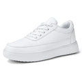 Women's white leather lace-up casual flat shoes on a neutral background.