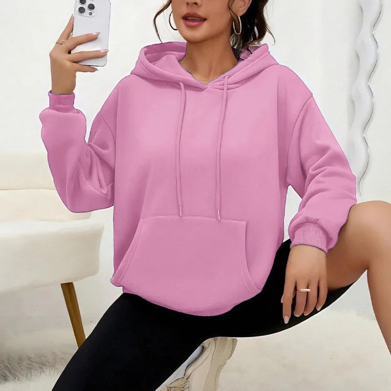 Women's loose fit grey drawstring hood sweatshirt with front pockets, long sleeves