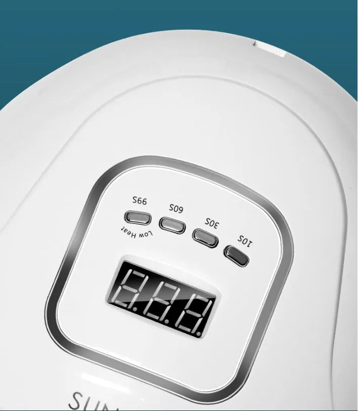 White nail polish dryer lamp with UV and LED light beads and digital timer display.