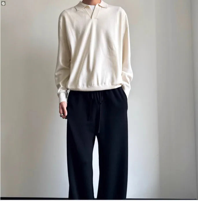 Pure wool polo sweater with lapel collar in loose fit, shown in milky white.