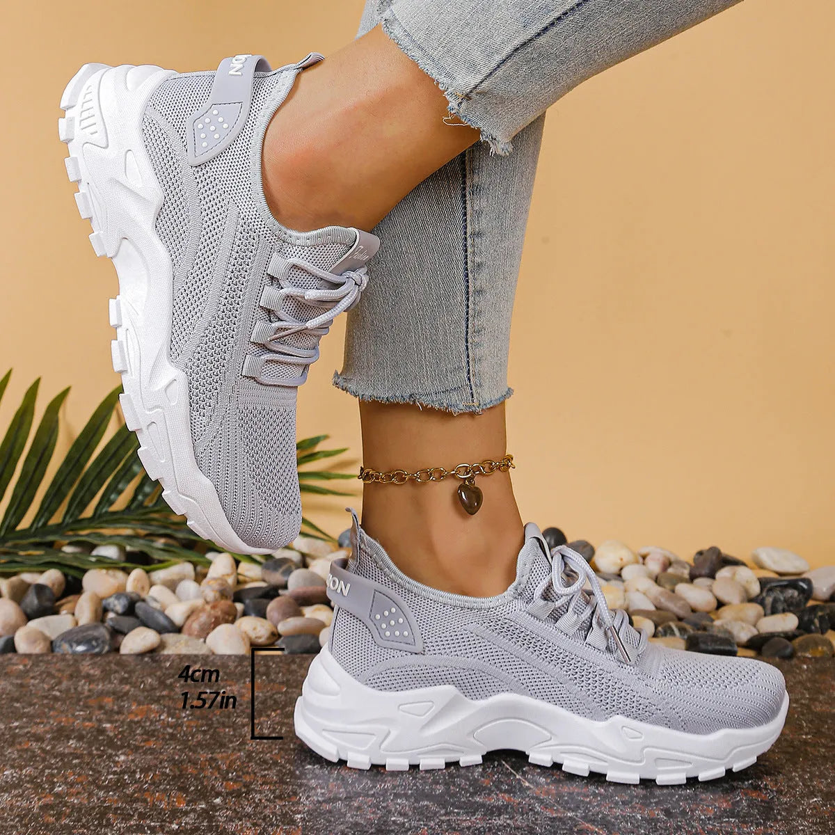 Women's low-top sneakers with mesh upper and platform sole in various colours.