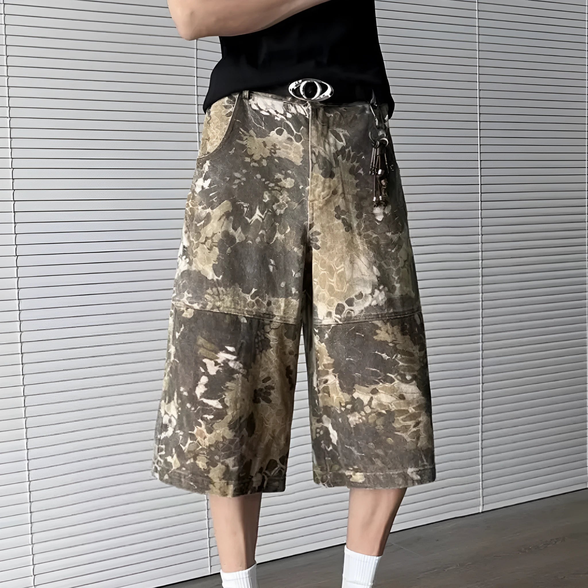Yellow snake camouflage cropped jeans on a denim background