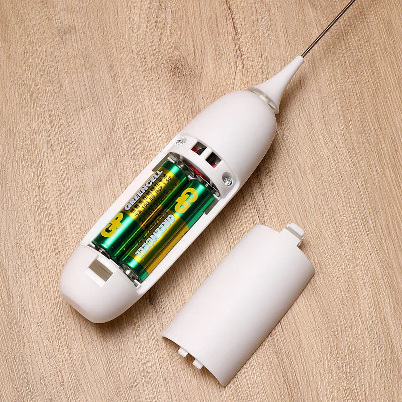 A hand-held electric milk frother in black and white colour options on a kitchen counter.
