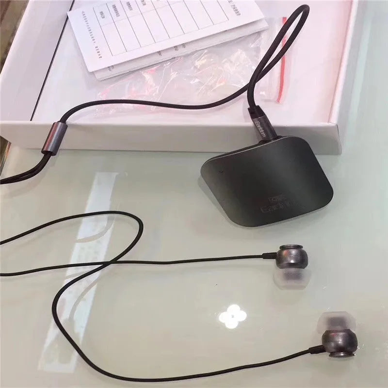 Black Bluetooth lavalier audio receiver for converting wired running headphones to wireless with 10-metre range