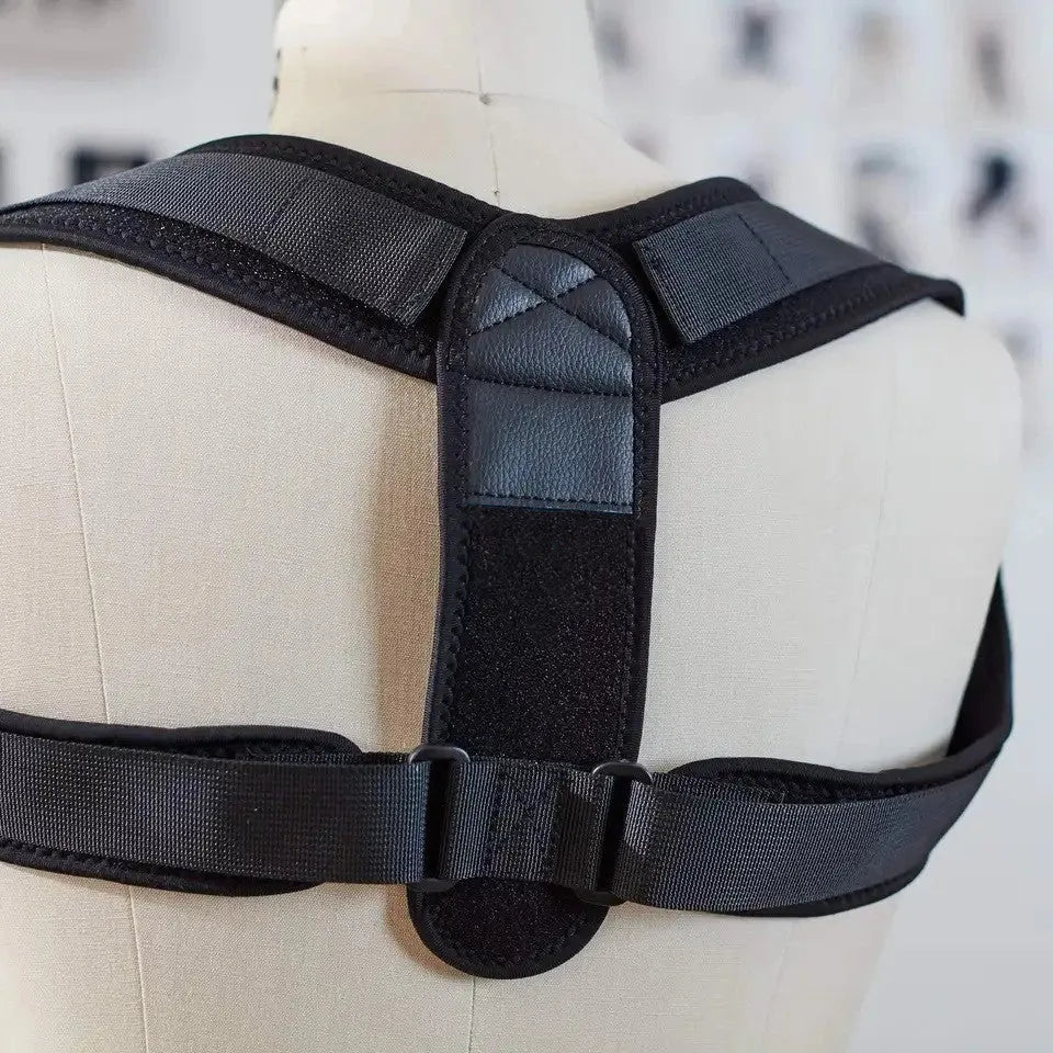 Black adjustable posture correction strap with hook fastening on mannequin torso