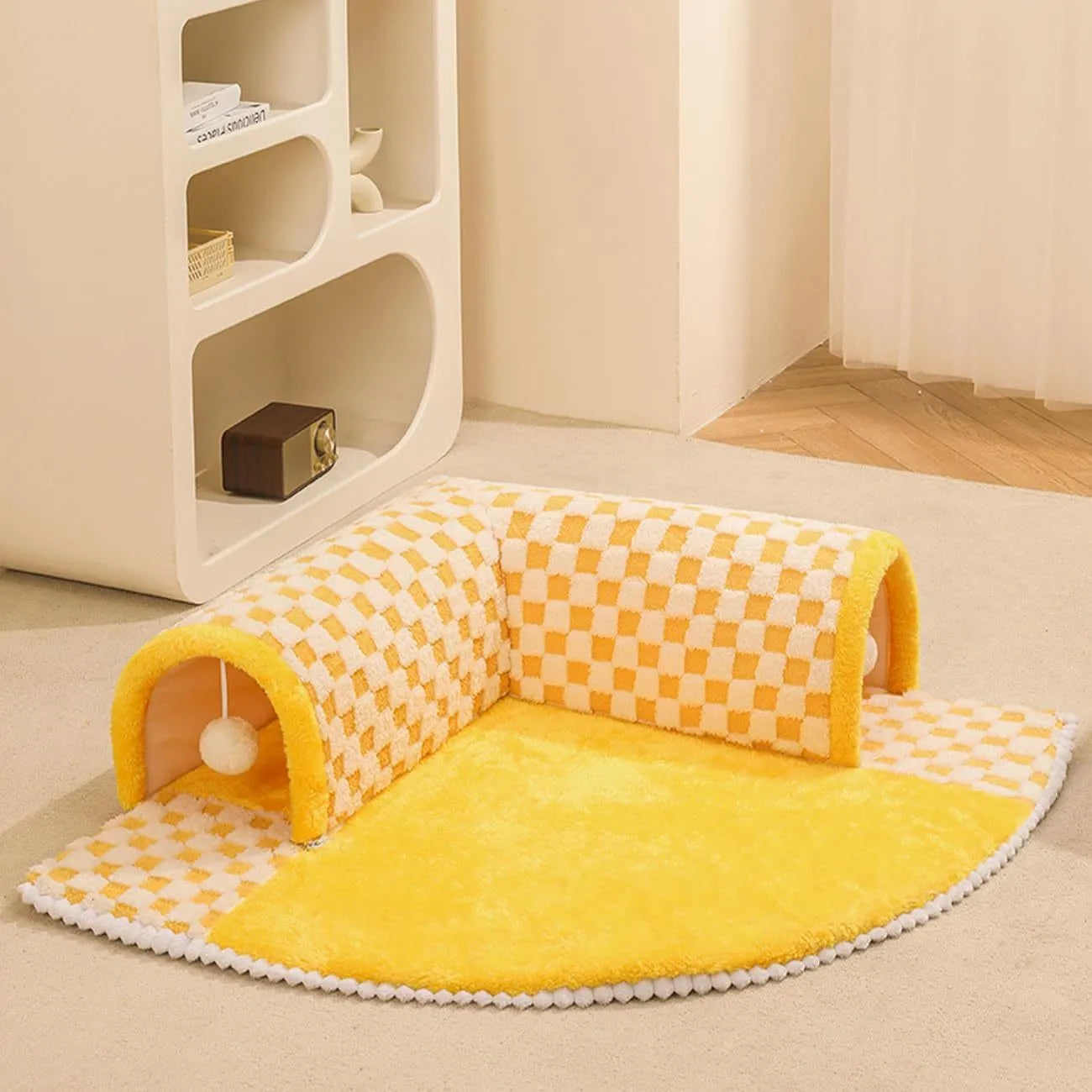 XL coffee coloured plush fan-shaped pet bed with a tunnel for dogs and cats on a wooden floor.