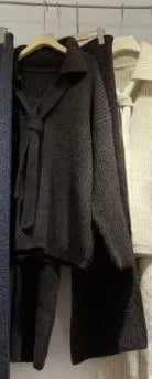 Beige imitation cashmere knitted top and matching trousers two-piece set laid flat.