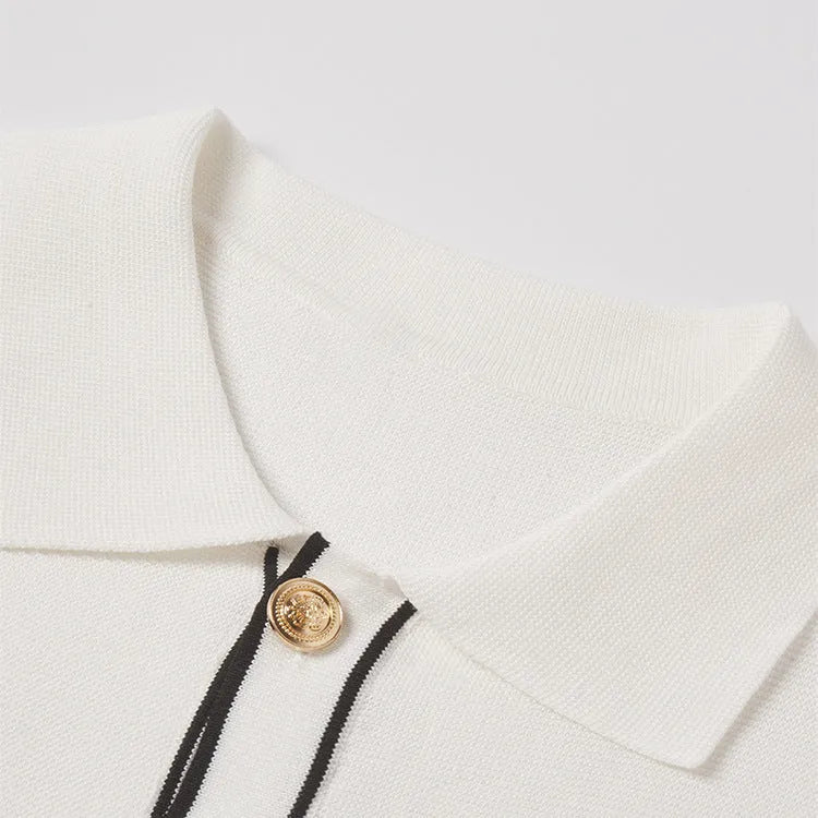 White women's short sleeve cardigan with dark contrast lapels on a front view.
