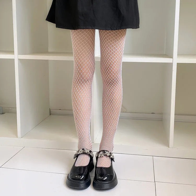 Women's black and white mesh stockings showing large, medium, and small net patterns on a leg.