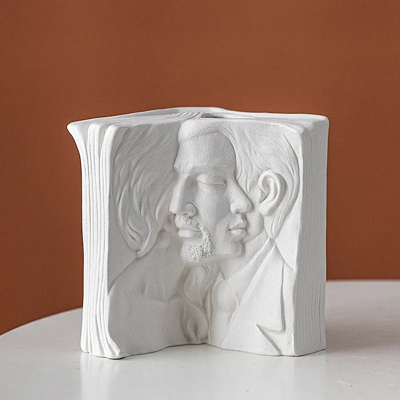 Ceramic book stand with glazed finish in one of four artistic designs on a desk.