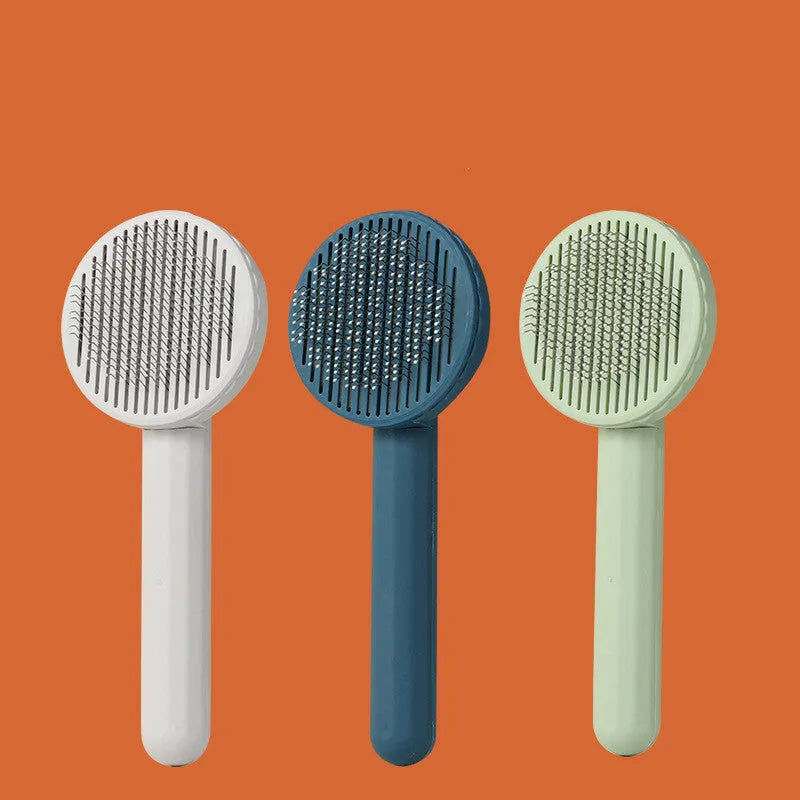 Button self-cleaning pet comb with stainless steel needles and ABS handle in blue colour