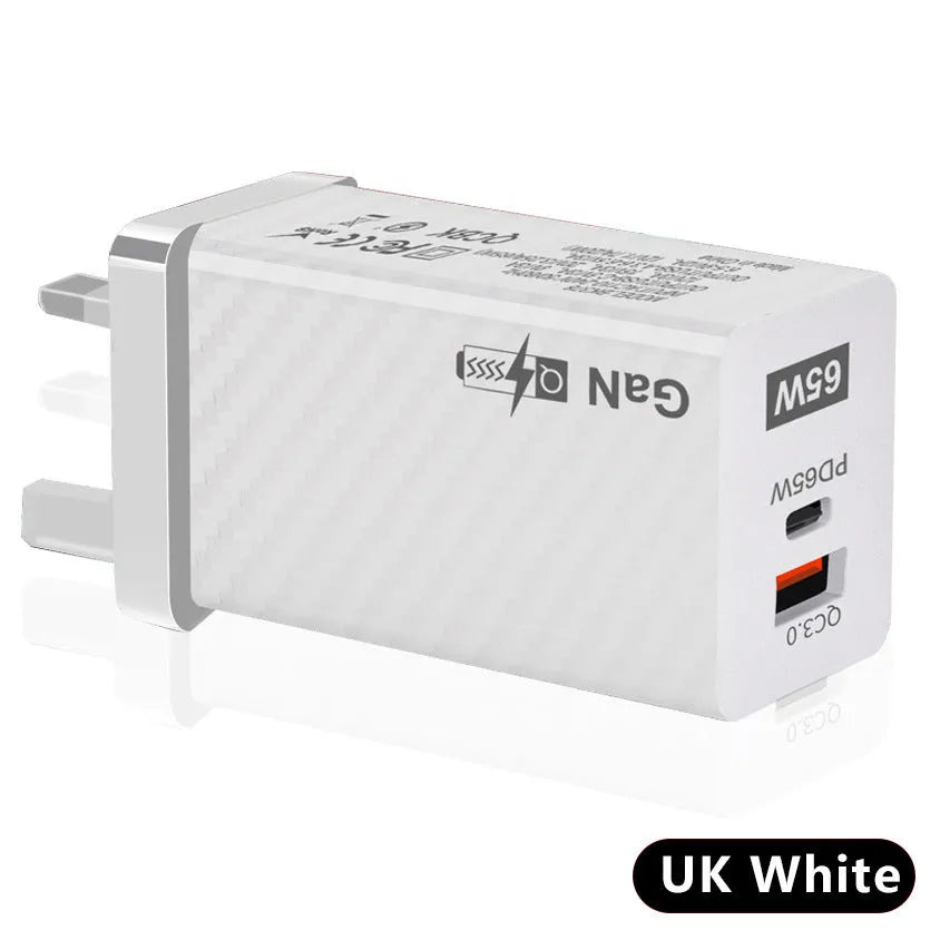 Compact white 65W Gallium Nitride laptop charger with USB-C port next to EU and US plug options.