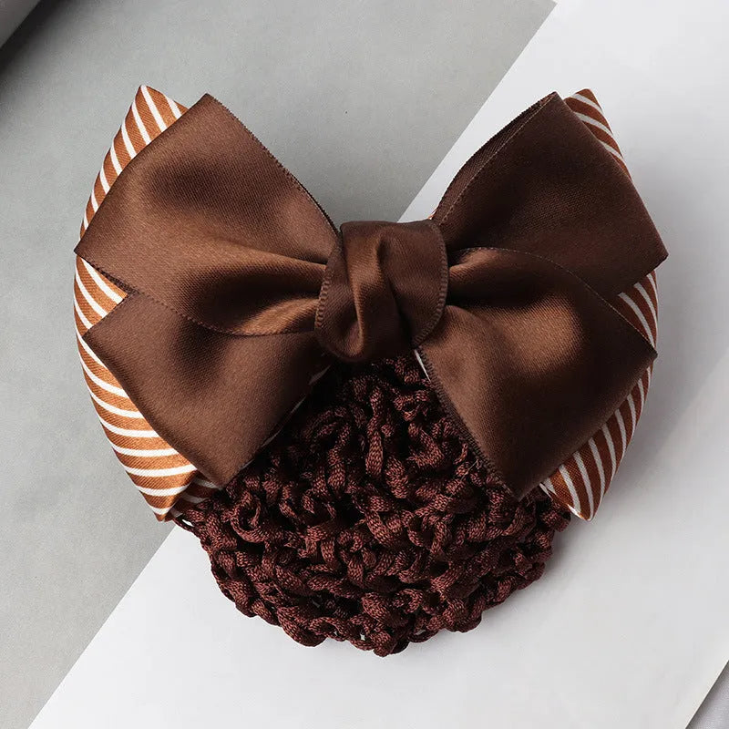 Professional hair clip with a black net pocket and a red flower bow ornament on a white background.
