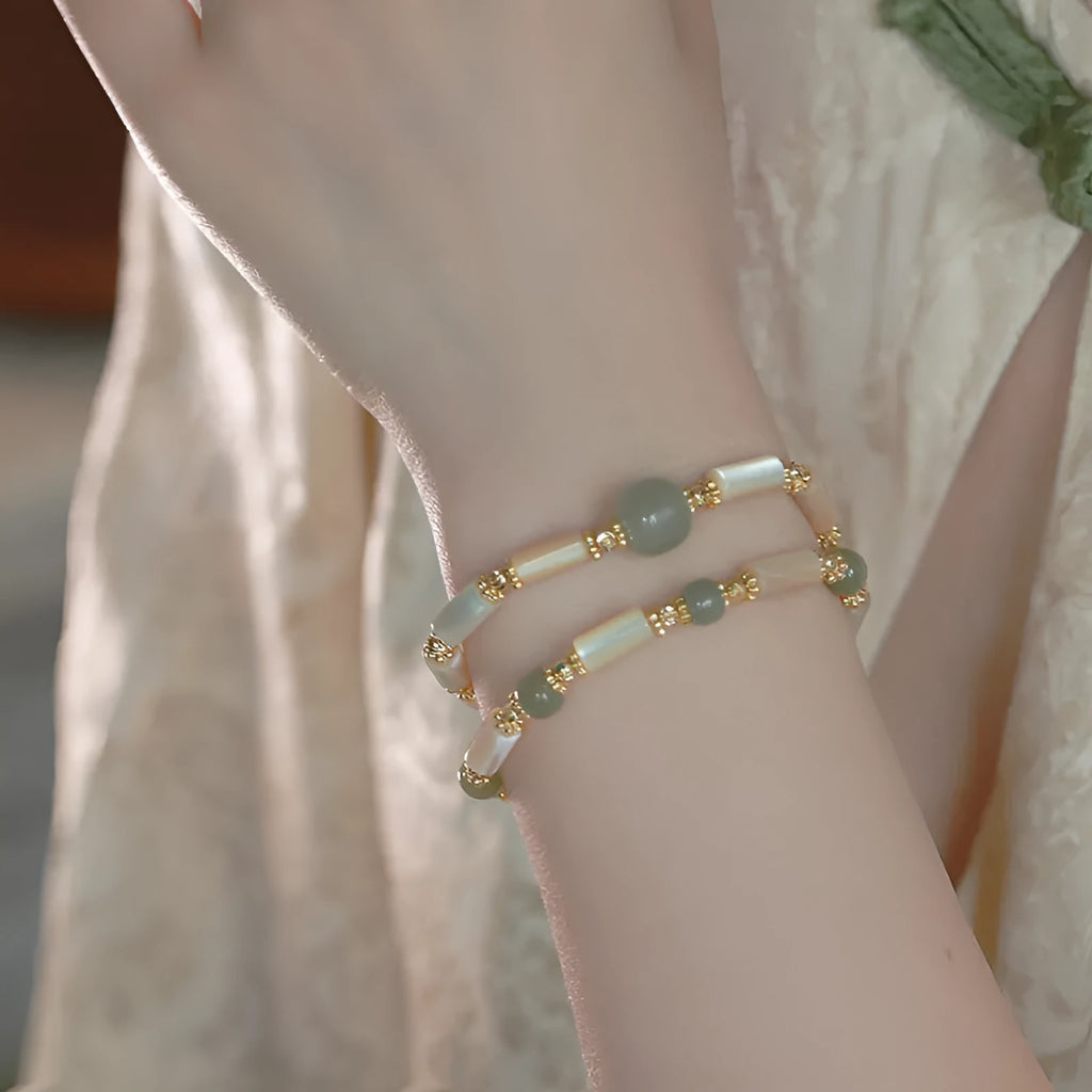 Natural Hetian Jade white lip shell bracelet for women with round beads and geometric design