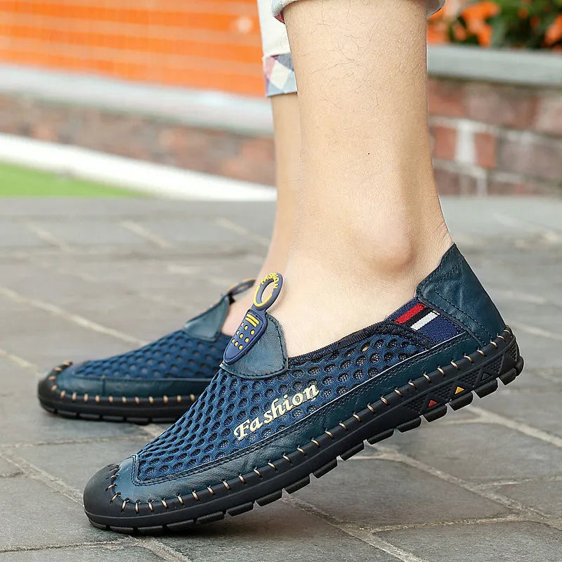 Men's brown breathable mesh casual shoes with round toe and rubber sole on a plain background.