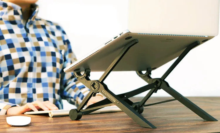 Black folding laptop stand made of reinforced nylon, shown in a compact folded size.