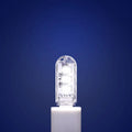 Compact round white LED night light with USB cable, shown with warm and white light illumination.