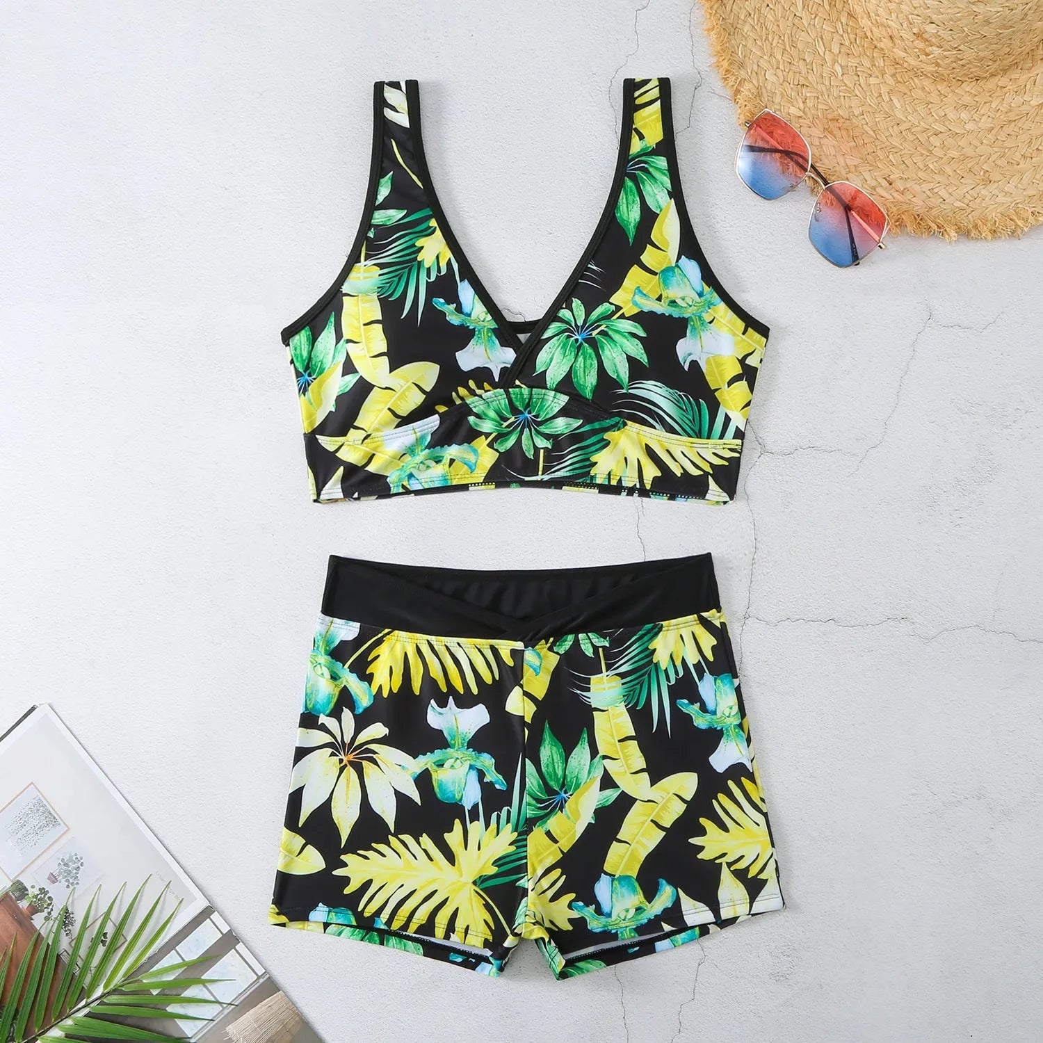 Women's two-piece printed swimsuit with high-neck top and boxer shorts in a multi-colour design.