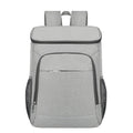 Large outdoor thermal picnic backpack in grey-orange colour with curved shoulder straps and compartments.
