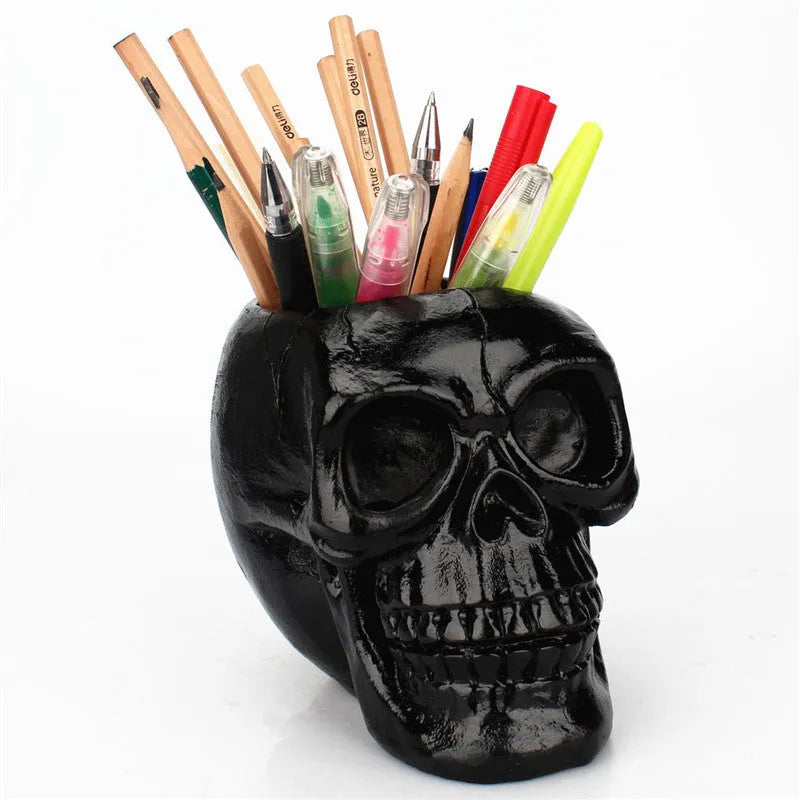 Skull head resin storage tube in black, 11x15x11cm, with open top showing inner 7cm diameter for storing beauty tools