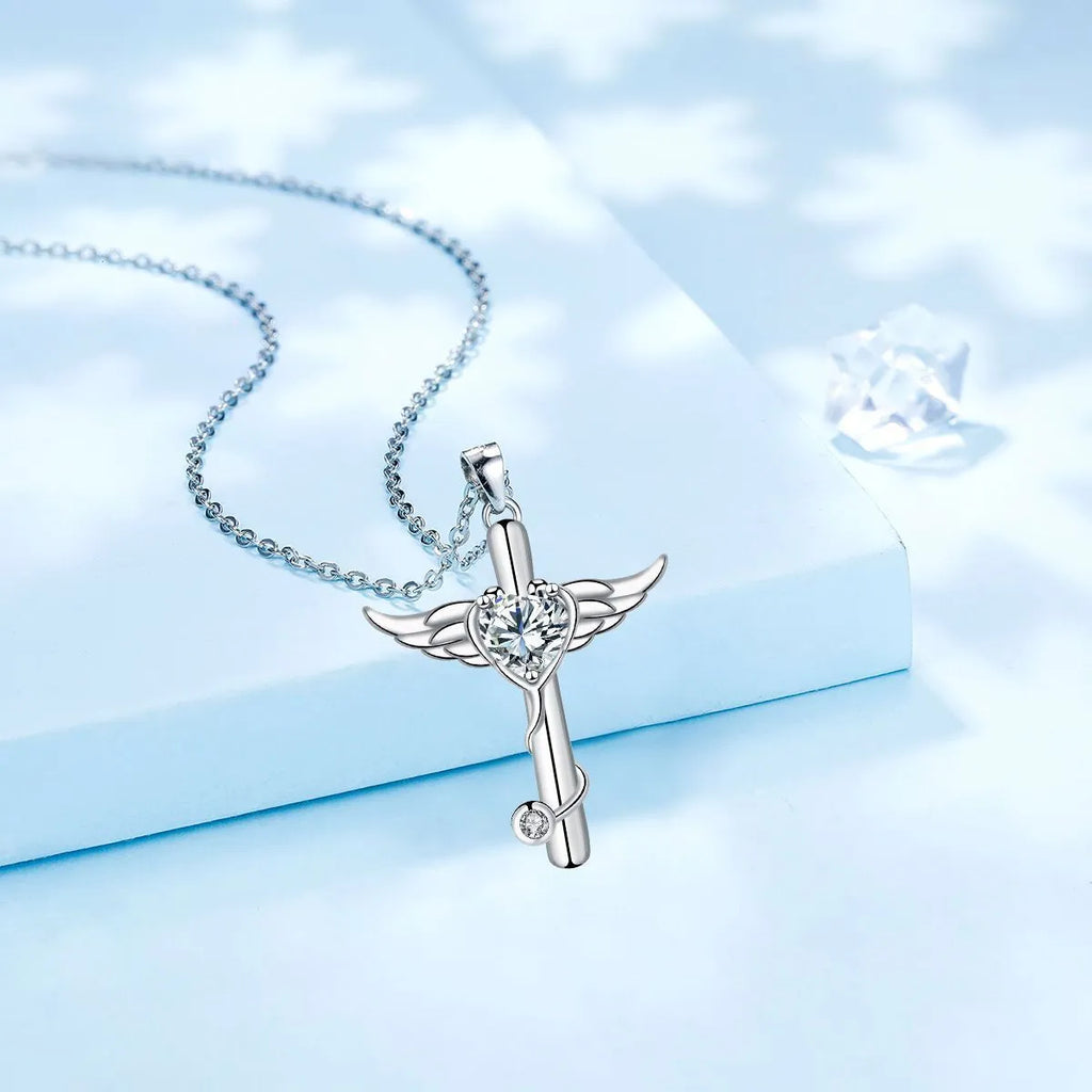 A copper stethoscope necklace with a cross and wings pendant in Red Diamond finish