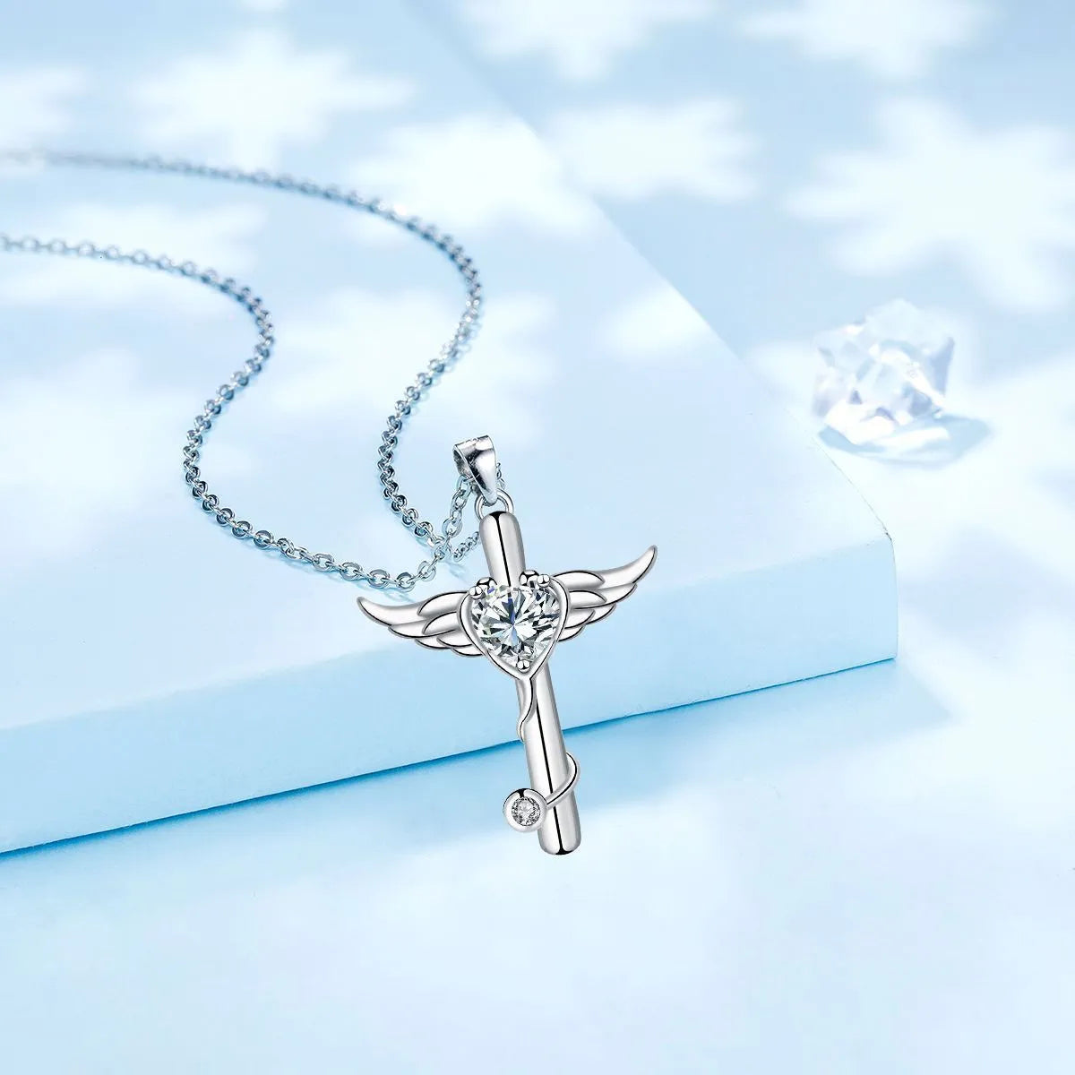 A copper stethoscope necklace with a cross and wings pendant in Red Diamond finish
