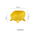 Green four-legged ceramic cat food bowl with elevated base and wide mouth design