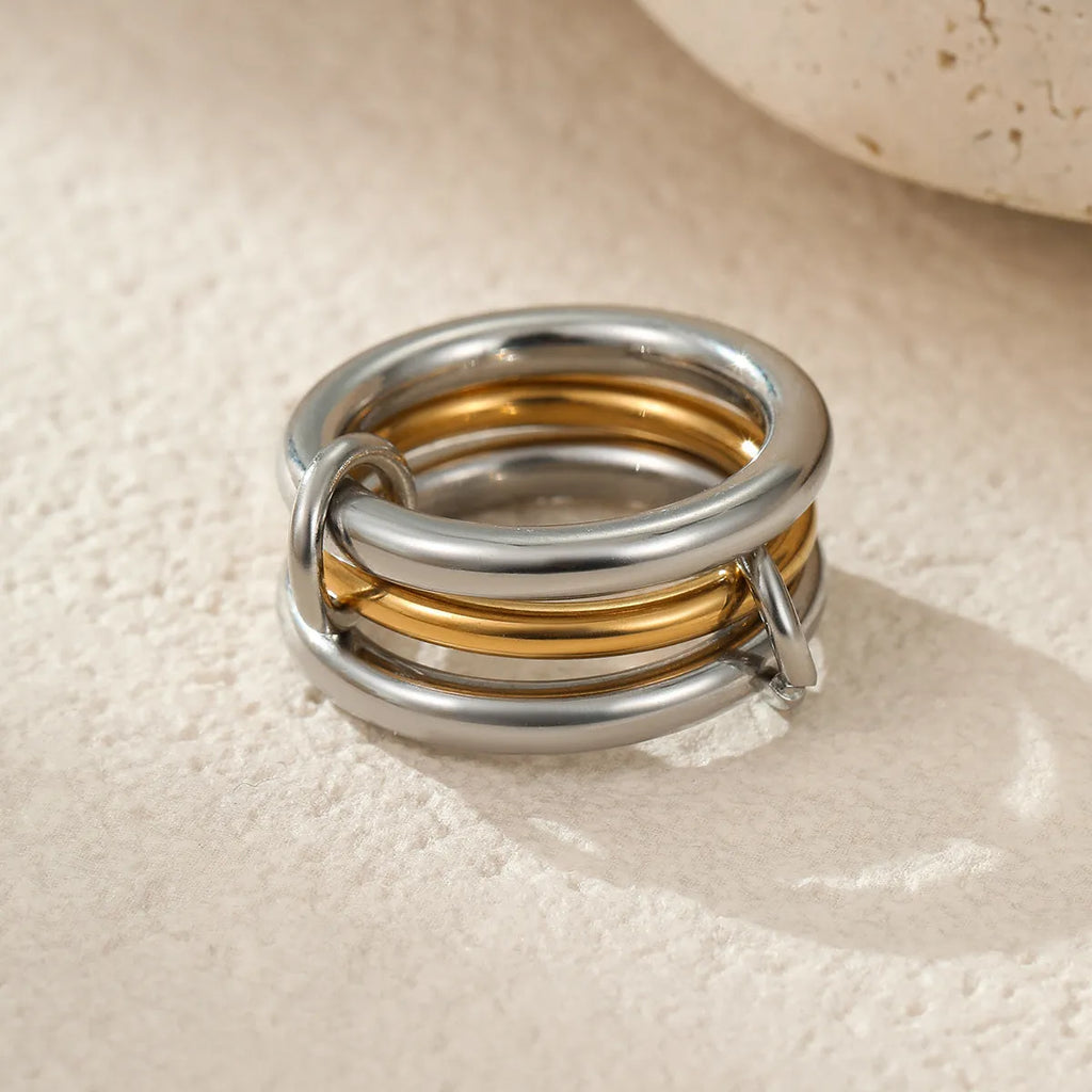 Stacked colour matching stainless steel ring set with 18K gold plating and exaggerated profile