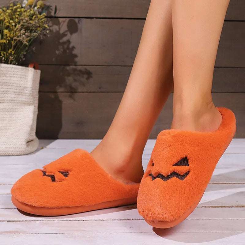 Orange pumpkin design Halloween slippers with plush lining and PVC sole for indoor home wear