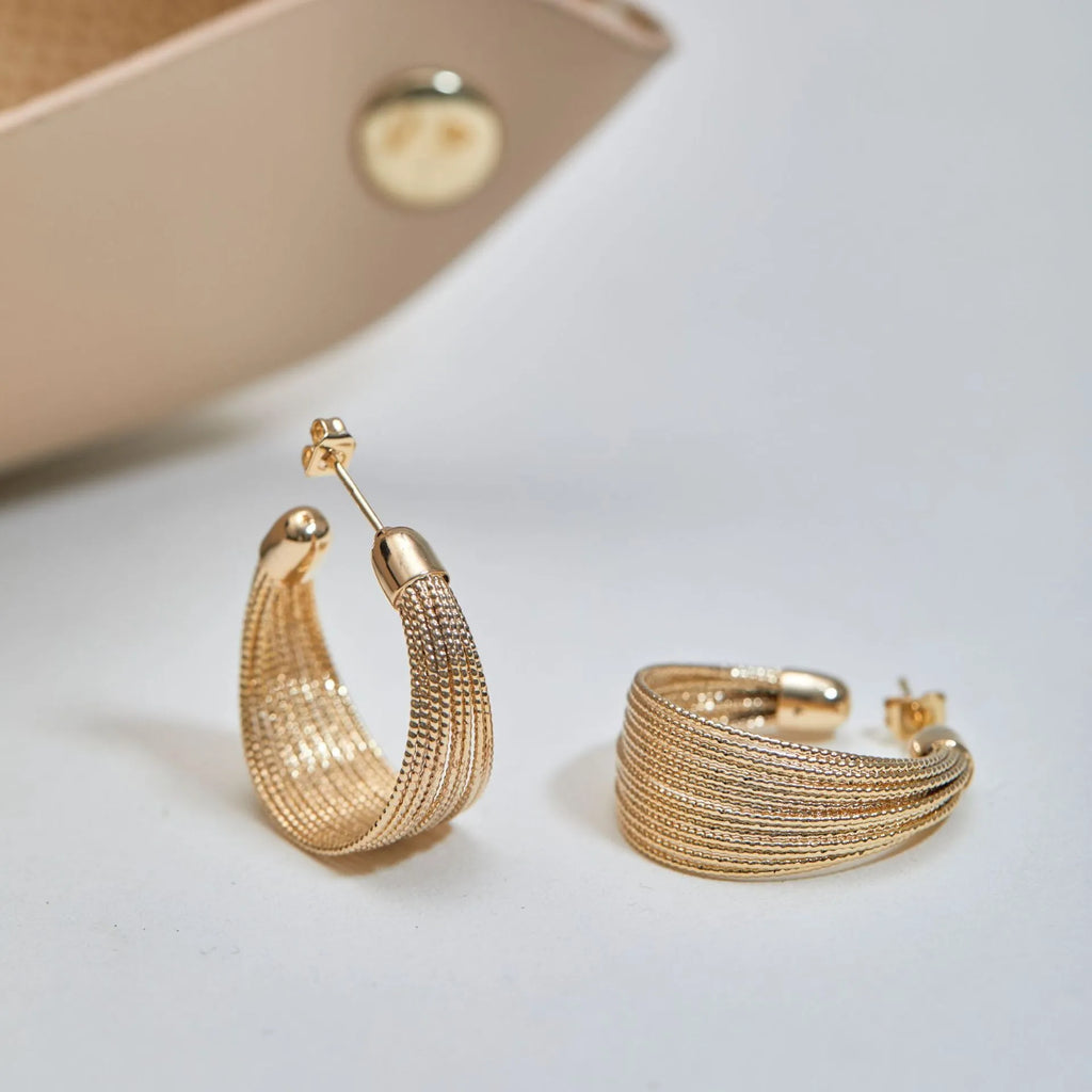 Multi-layer geometric bracelet earrings in gold and silver colour options as studs and clips