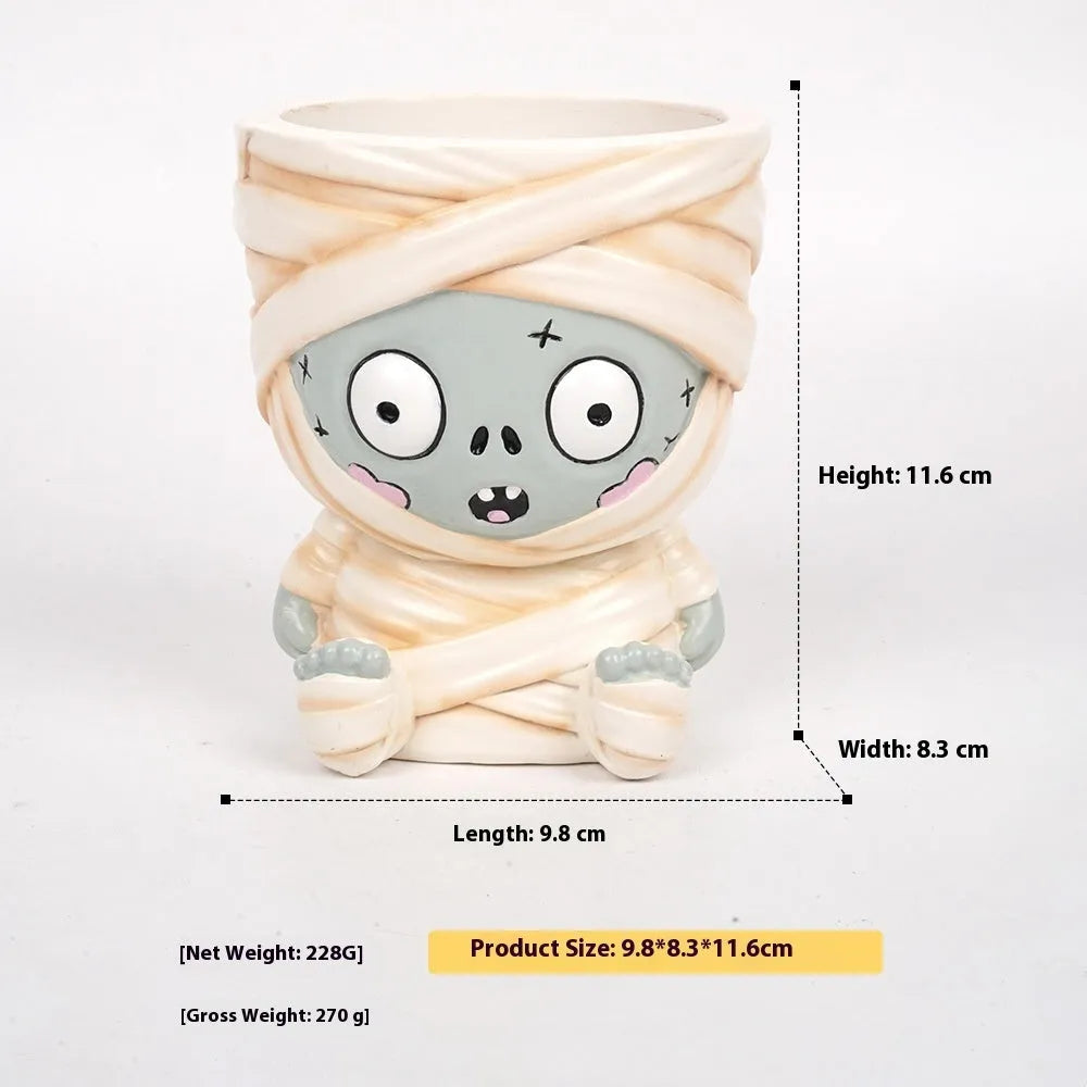 Four Halloween cartoon character resin flower pot decorations with hand-painted details
