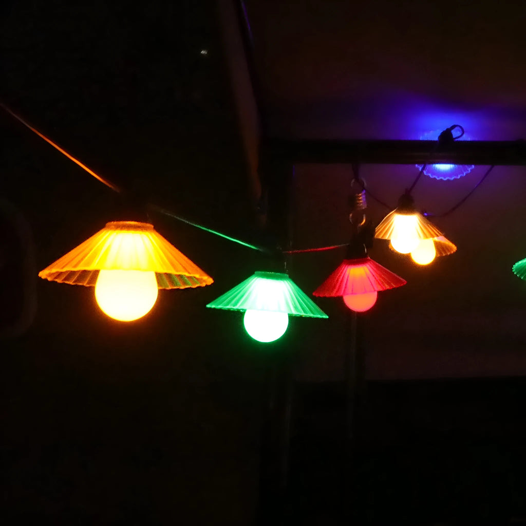 Outdoor flower-shaped LED string lights with IP65 rating for garden and patio use.