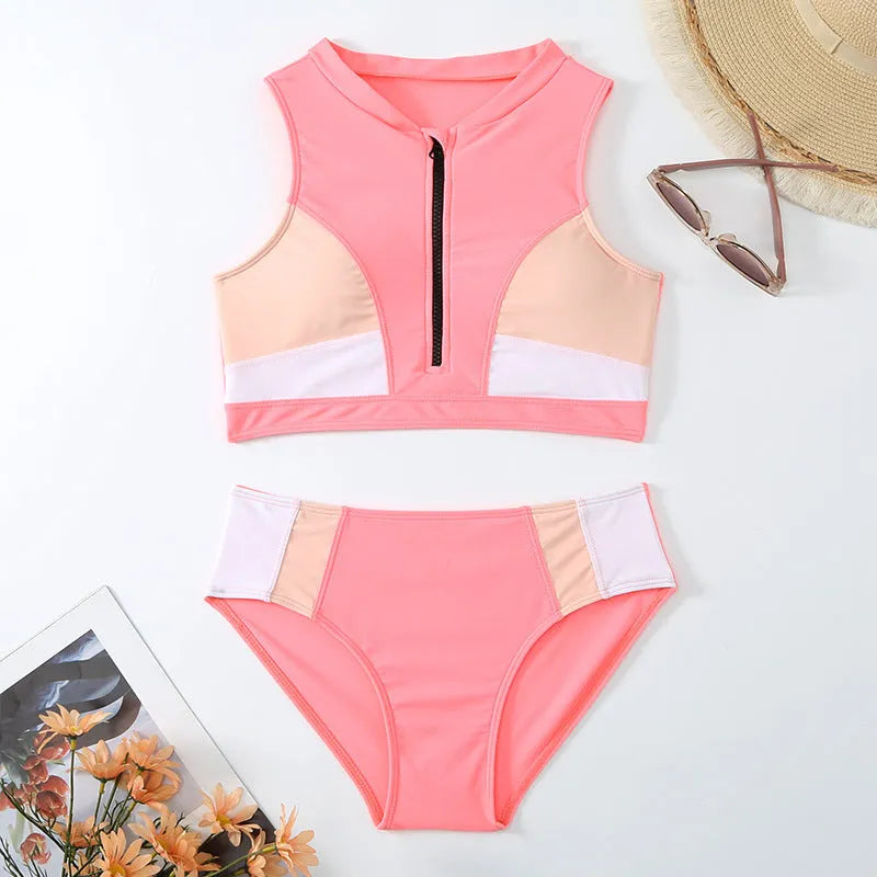 Pink high waisted women's bikini swimsuit with briefs and sleeveless top on mannequin