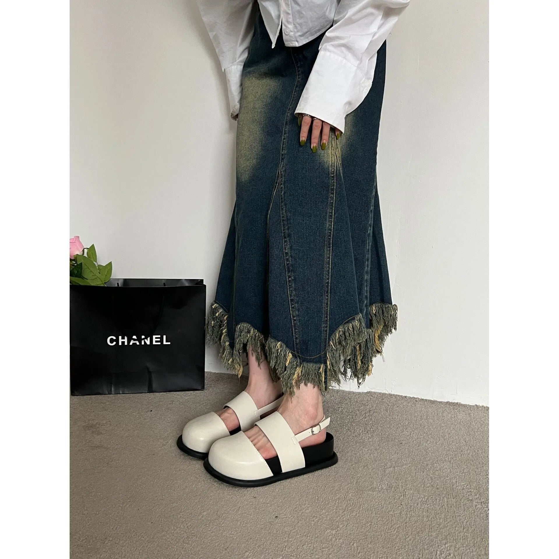 Retro closed toe sandals with raised bottom, ankle strap buckle, and round toe in apricot colour