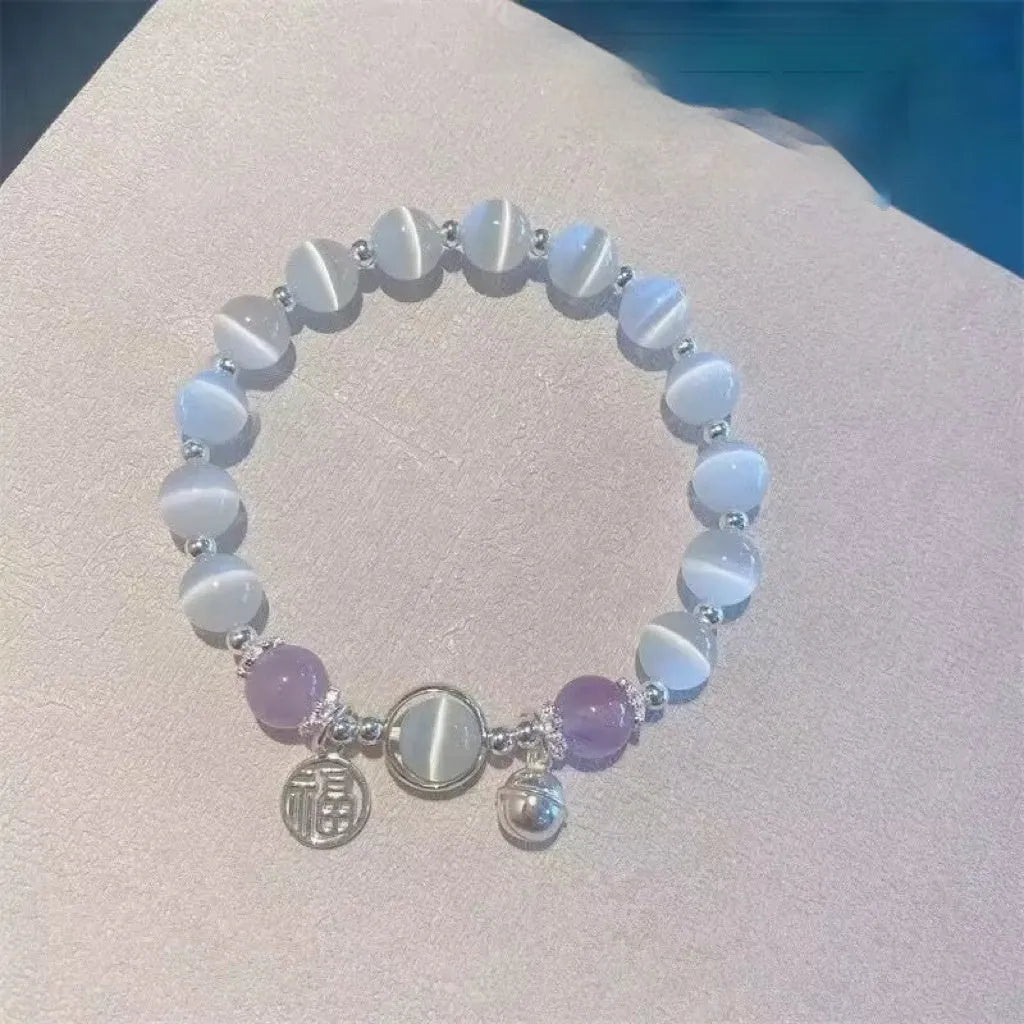 Women's glass butterfly drop-shape bracelet in a grey colourway with round details.